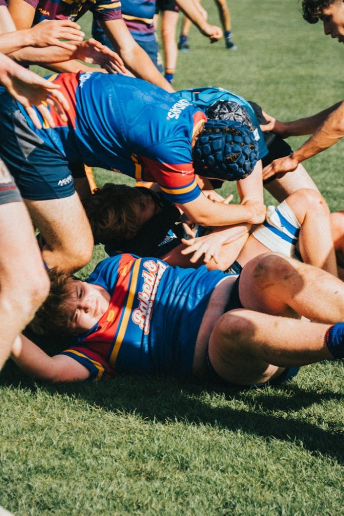 A dynamic and intense moment in a rugby match showing teamwork and athletic skill.