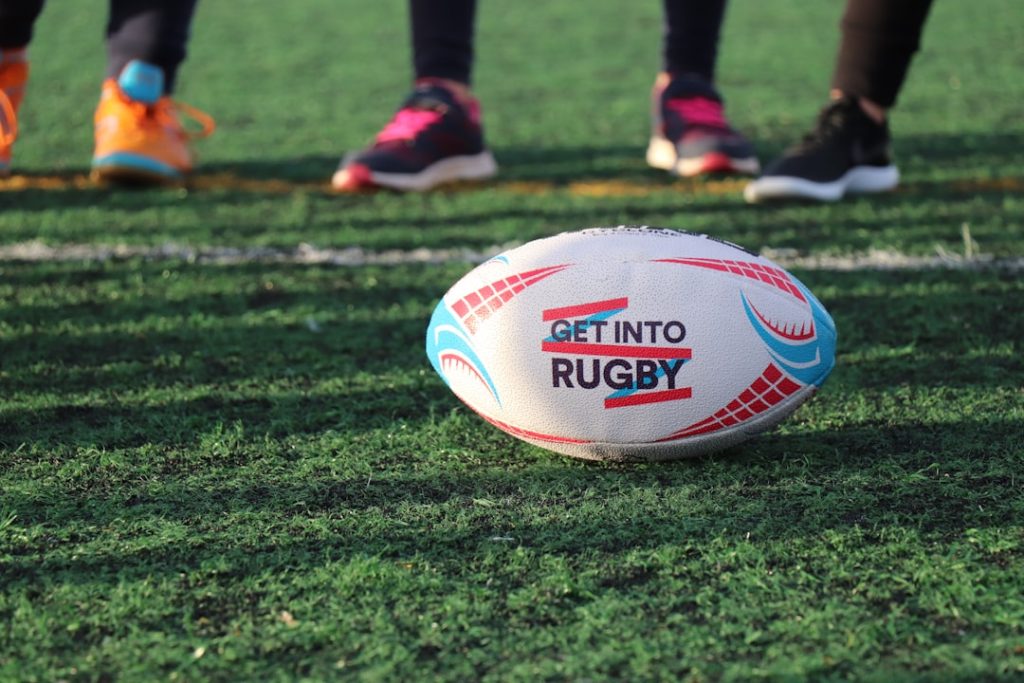 white-blue-and-red-football-on-green-grass-qcjg5hgpda0